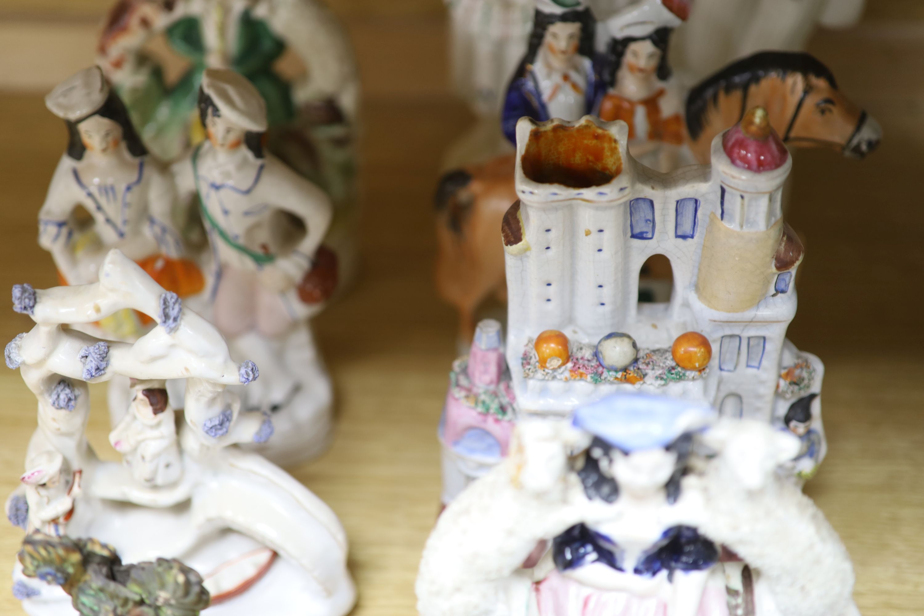 A collection of assorted Staffordshire figures and sundry ceramics including mid 18th century Staffordshire deer, tallest 33cm